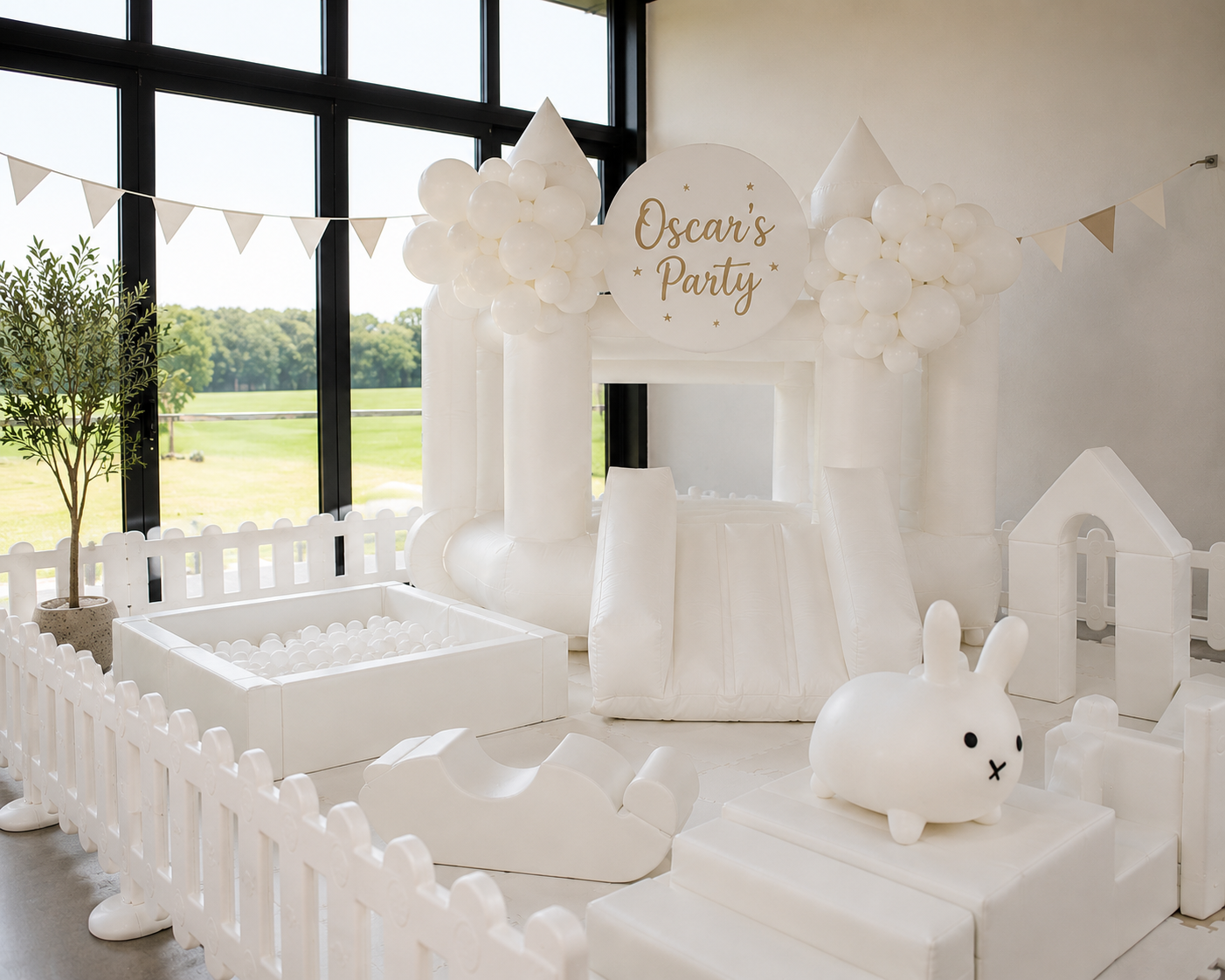 Rose and Rae white soft play, ball pit and bounce castle setup for Oscar's party